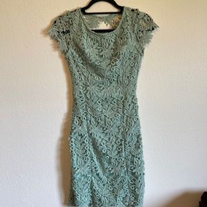 Pale, sage green dress with floral, texture pattern